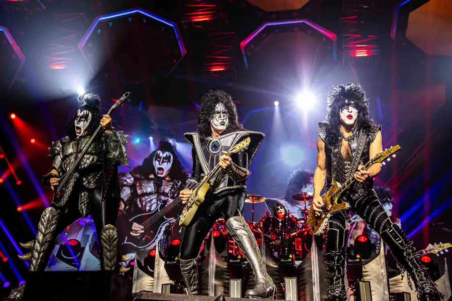 Kiss shared at Rock on the Range festival, capturing a moment of love amidst a lively music event.