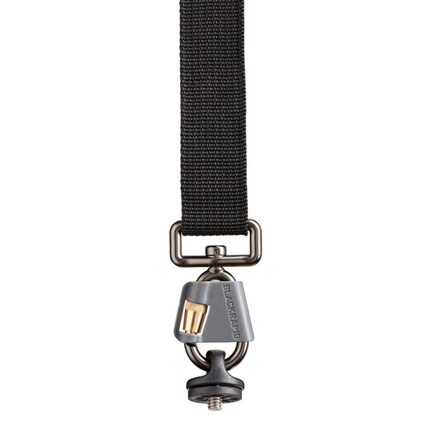 BlackRapid Cross Shot Breathe Camera Strap in black, featuring a non-slip rubber shoulder pad, adjustable length, and locking carabiner.
