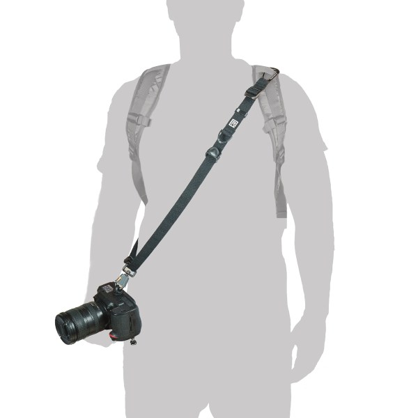 362001-Backpack-Breathe-04 - BLACKRAPID Canada Person wearing BlackRapid Backpack Breathe adapter with camera secured to backpack strap.