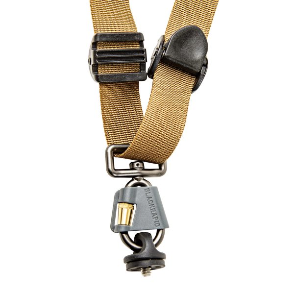 Cox_BlackRapid-2019Jan_2042 - BLACKRAPID Canada A pair of camera sling straps with a metal buckle and clip, designed for comfort and durability during outdoor adventures.