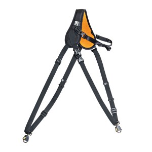A black and orange harness featuring a strap with Open, Twist Lock, and Close Lockstar mechanisms.